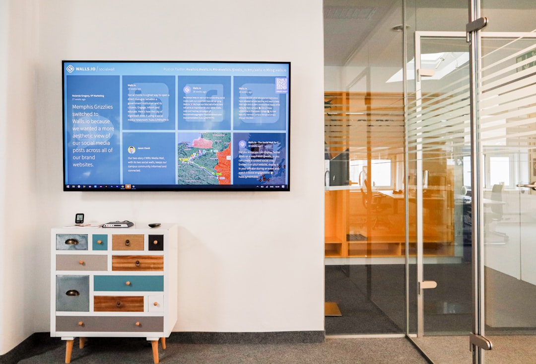 future office buildings era — open floor plan with cloud computing interface displayed on wall screens