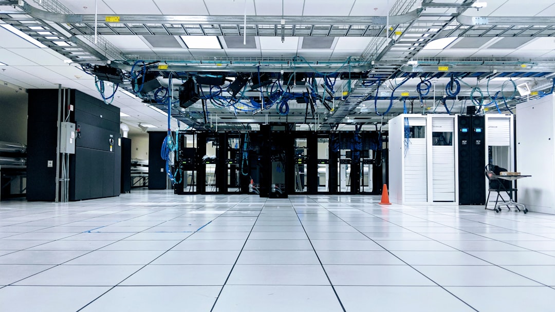 data center real estate — corporate office with data center facility layout plans on desk