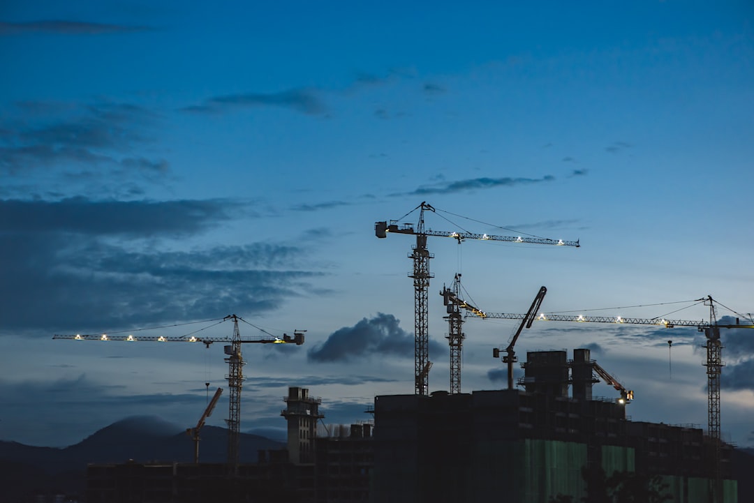 urban regeneration projects global — construction cranes over [mixed-use development](https://www.iceglobalnews.com/rise-mixed-use-developments-rapidly-2026/) with green terraces