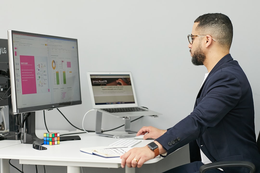 space insurance become major — underwriter analyzing risk models at desk with multiple monitors