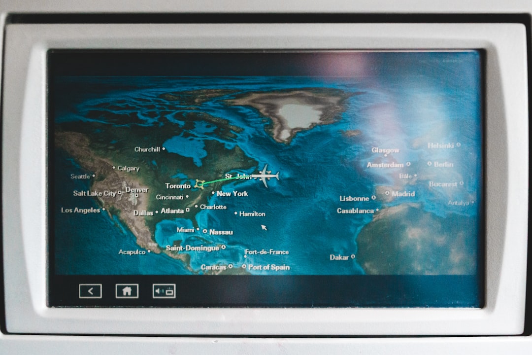 autonomous shipping change international — global port map with autonomous vessel tracking icons and weather overlays displayed on modern control center monitors