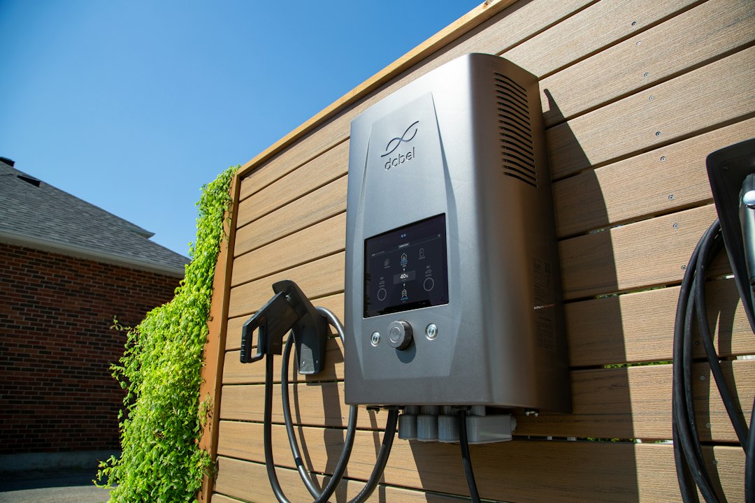 vehicle-to-grid technology change energy — AC and DC chargers installed at residential home charging station