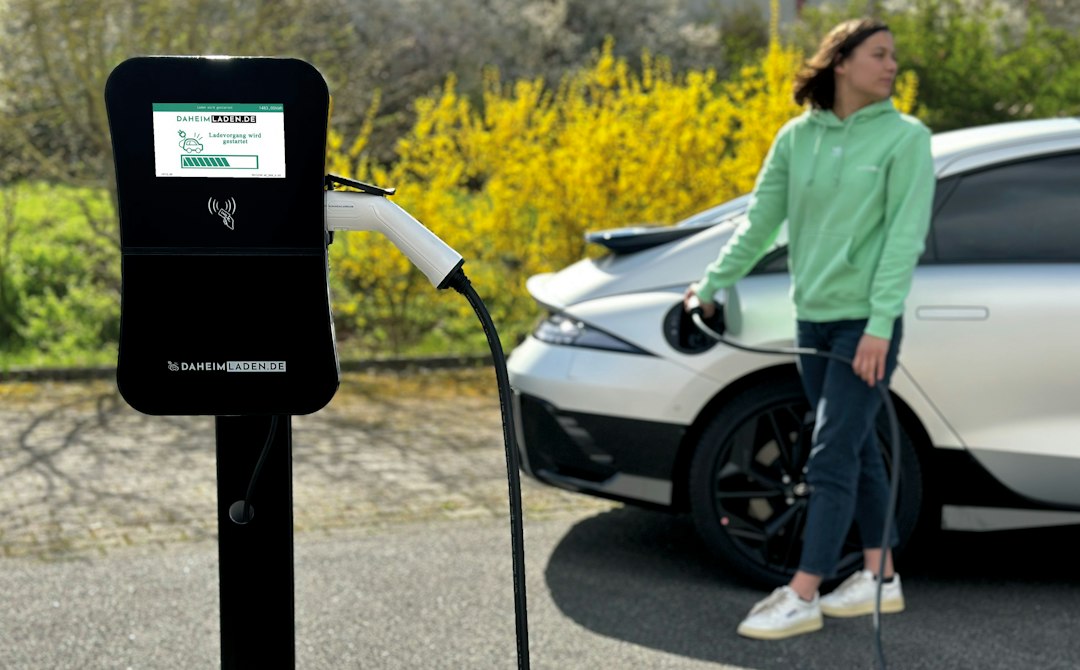vehicle-to-grid technology change energy — smart grid operator monitoring energy flows across multiple EV chargers on control room screens